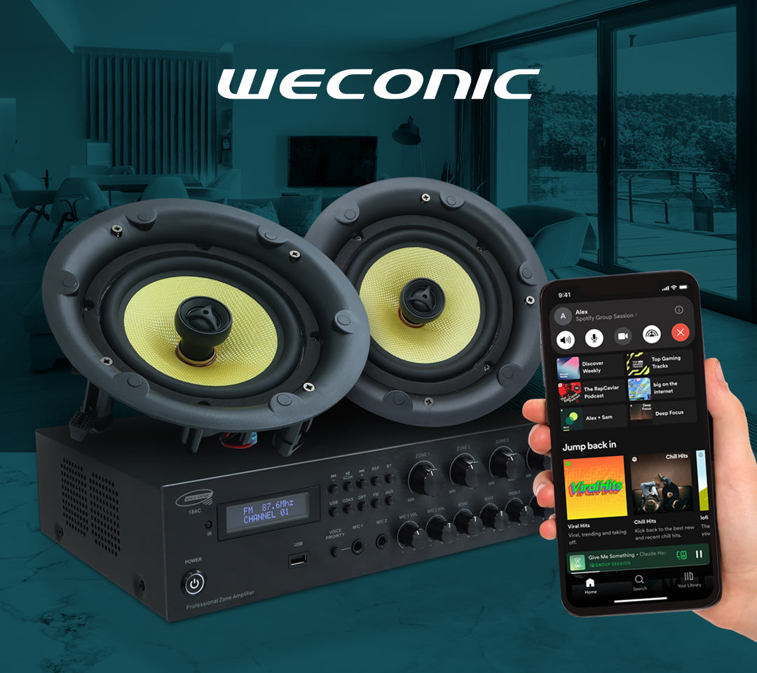 Two speakers with a amplifier and a smartphone in a living room