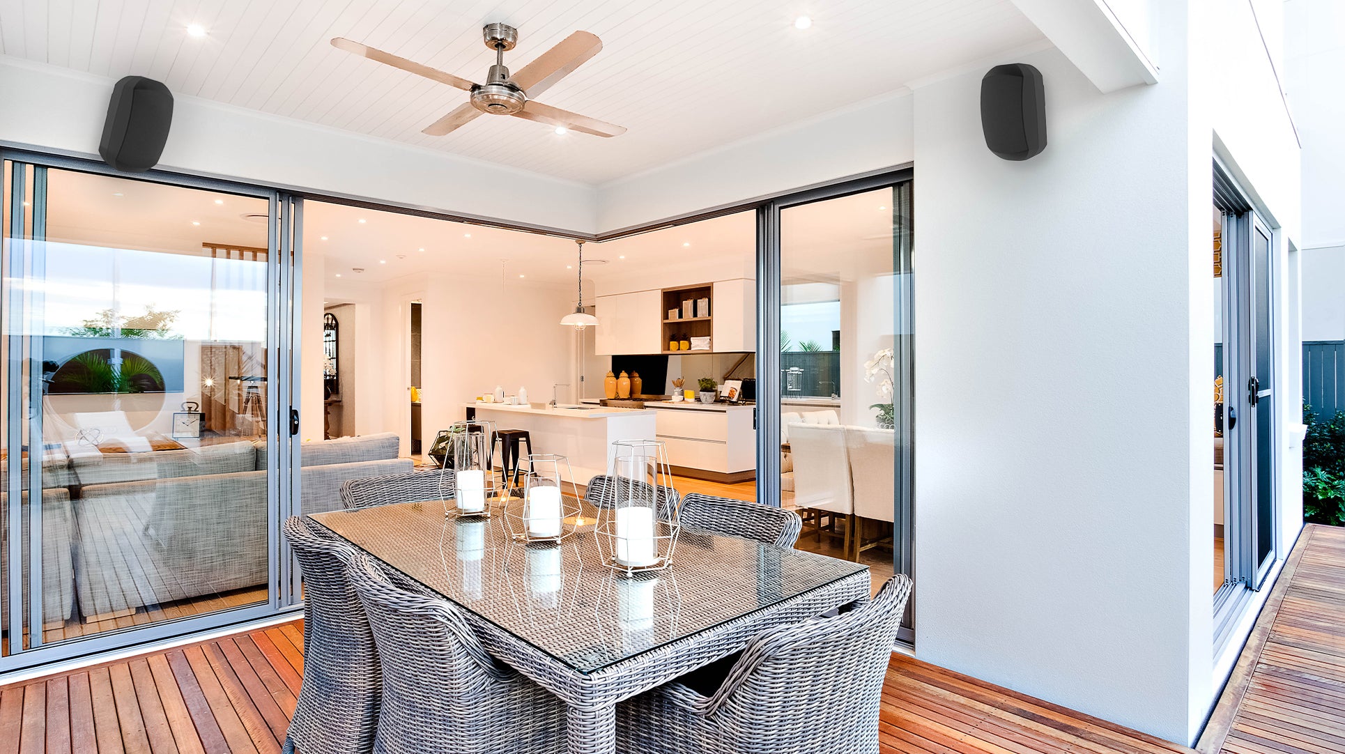 Pair of outdoor wall mount speakers in a patio